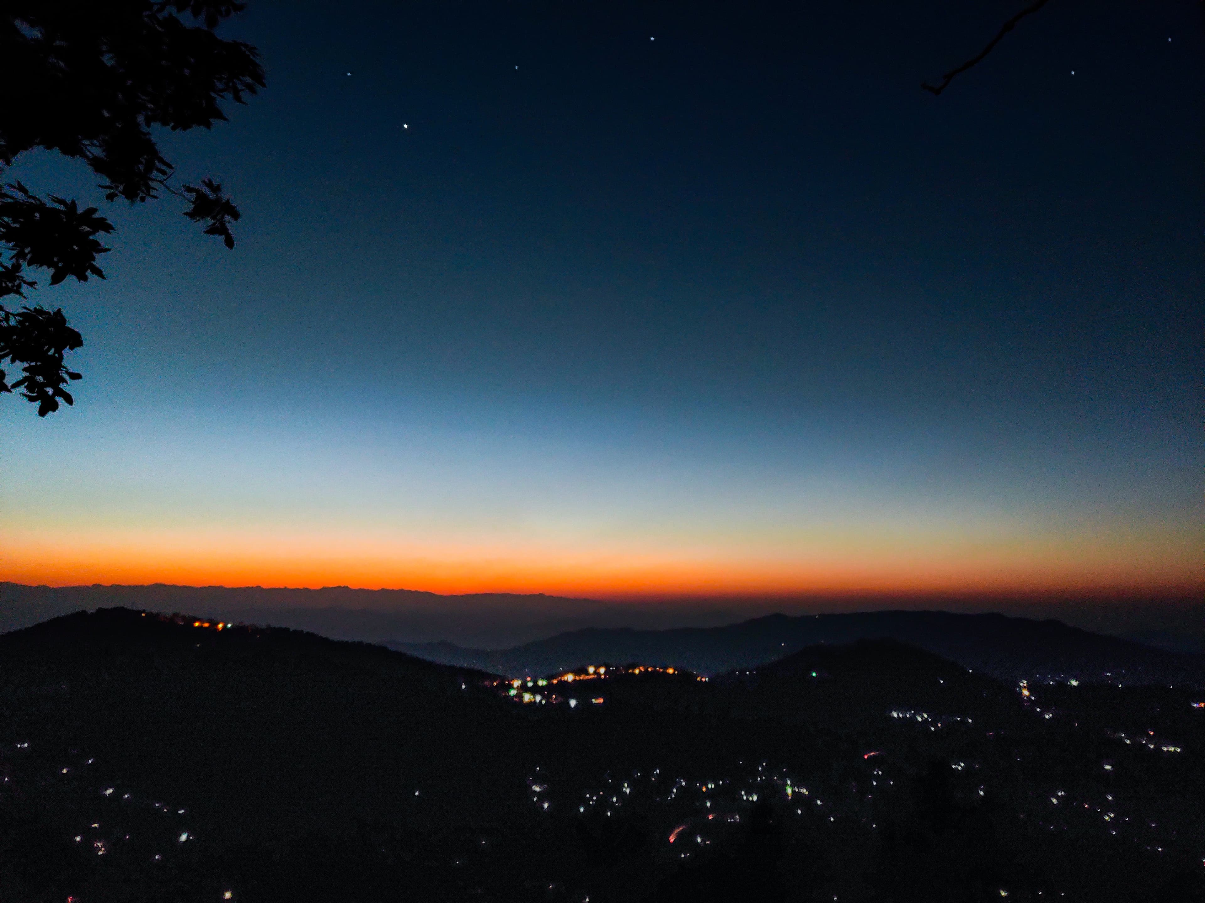 Twilight view over silhouetted mountains...
