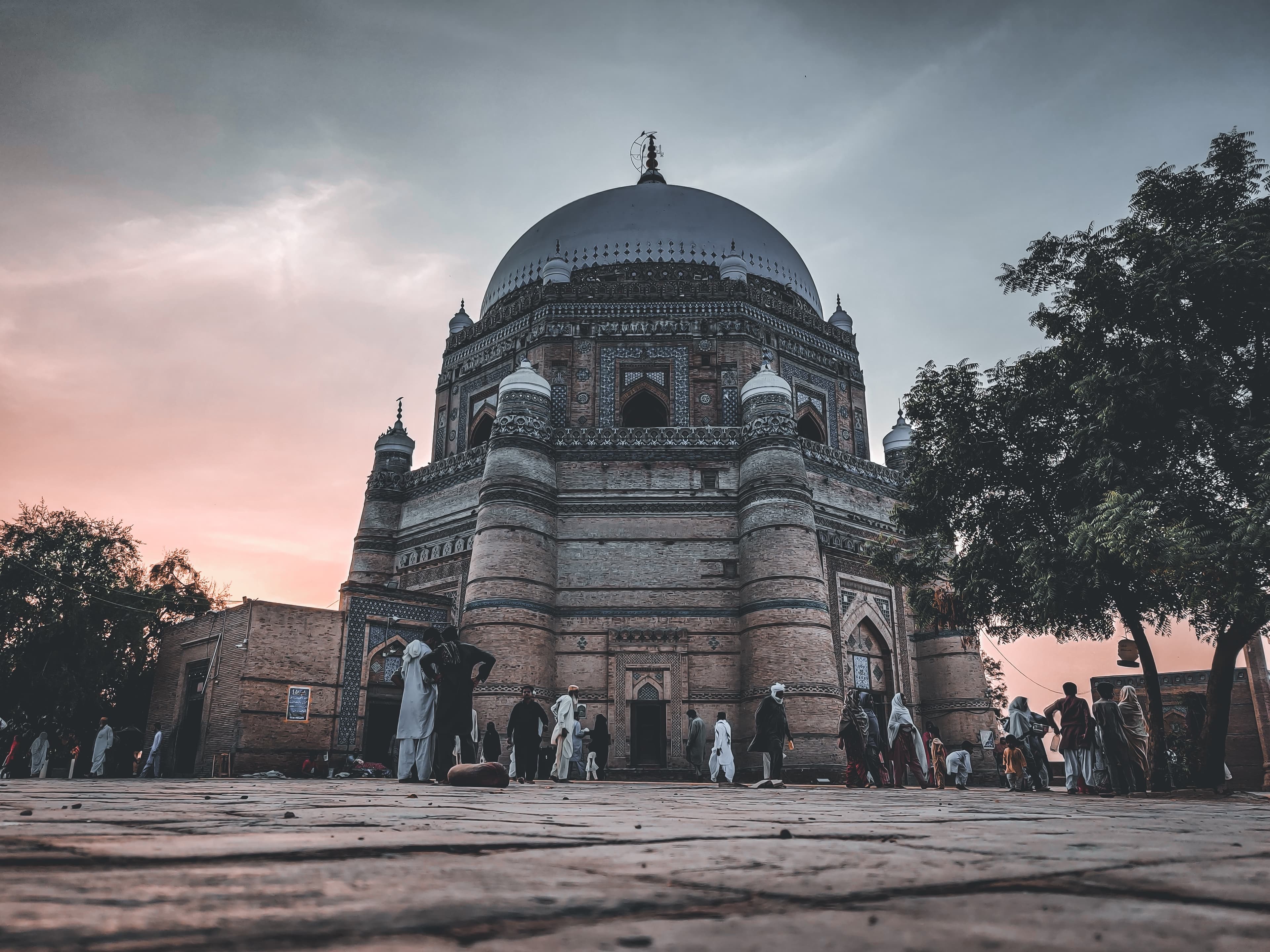 A low-angle, stylized shot of a grand domed tomb...